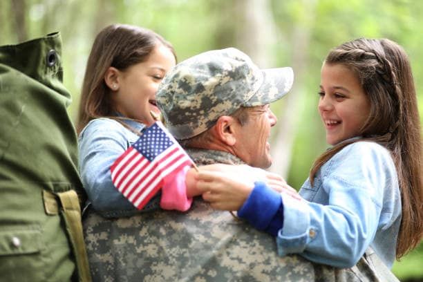 Veteran smiling with family