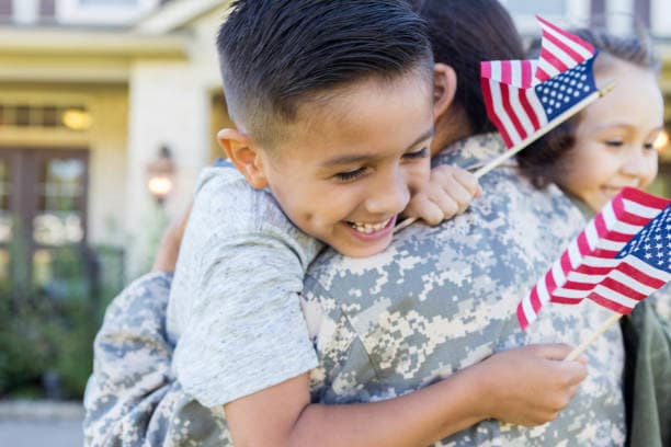 Child hugging a military parent