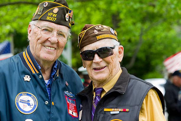 Two smiling veterans