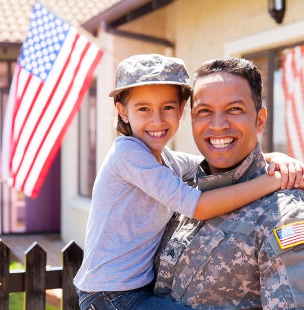 Smiling military father with daughter